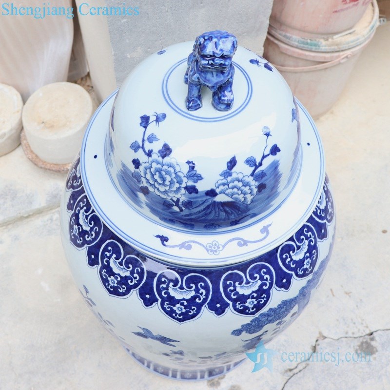 blue and white handmade  ceramic jar with lion's head shaped lid