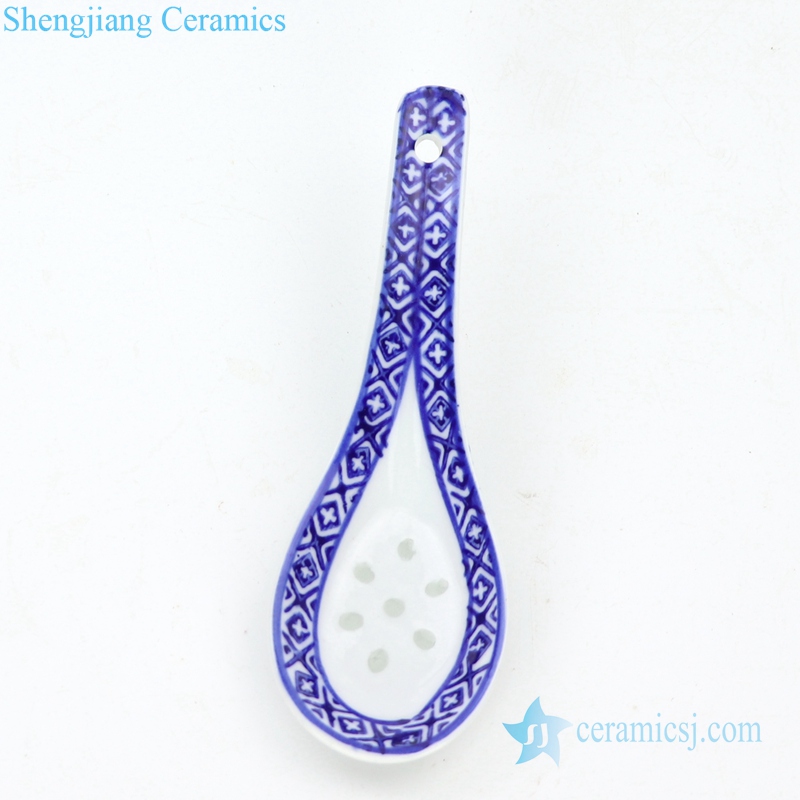 handmade blue and white ceramic spoon with pattern 